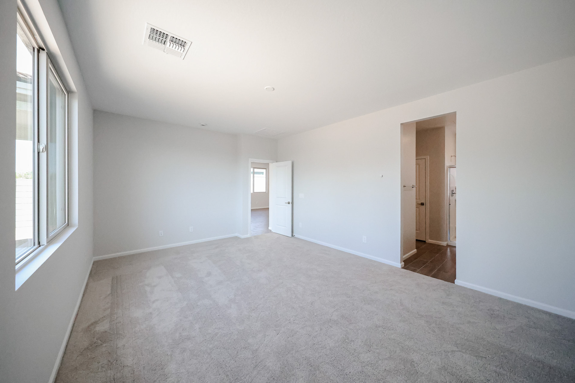 A hallway with white walls.