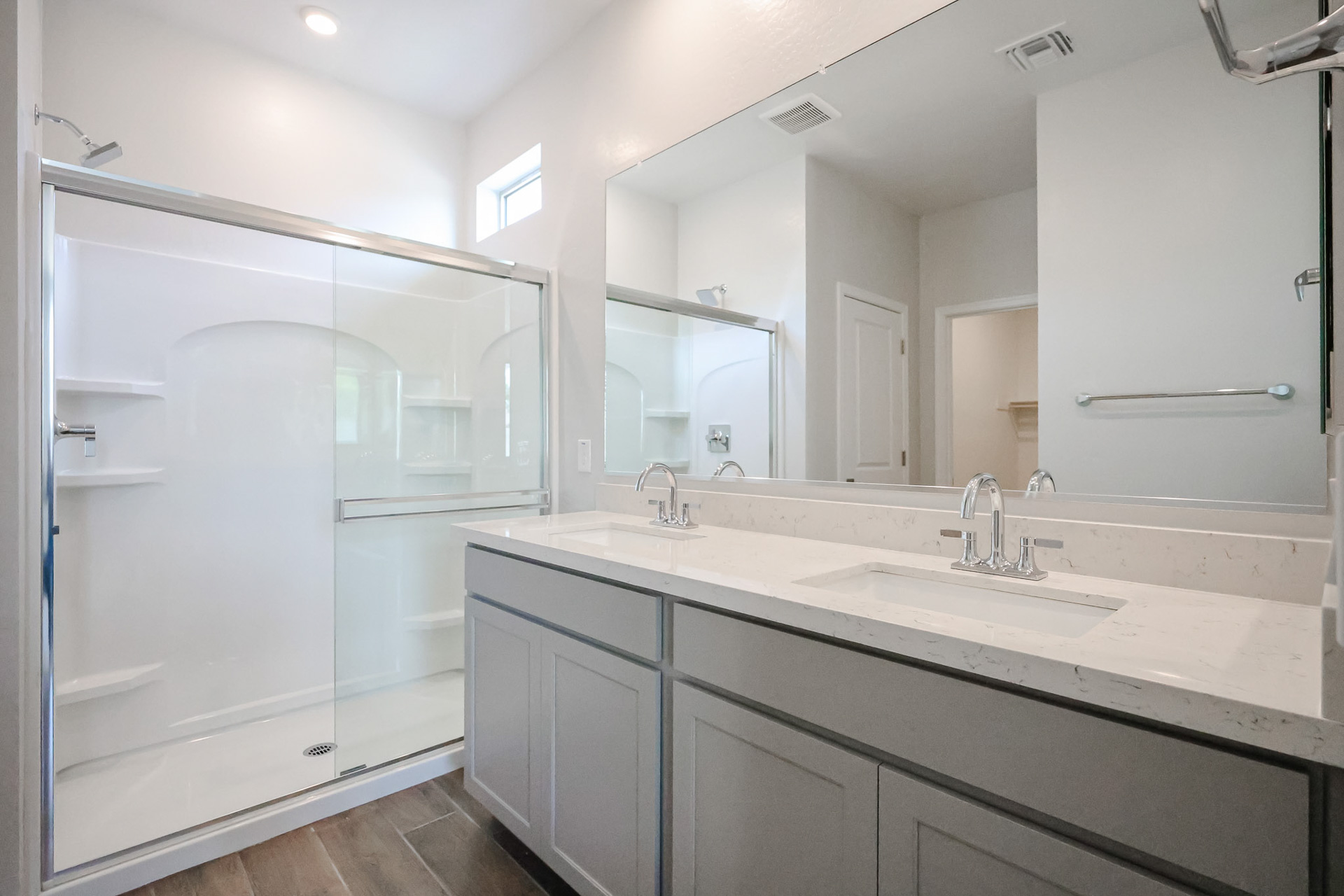 A bathroom with a glass shower.