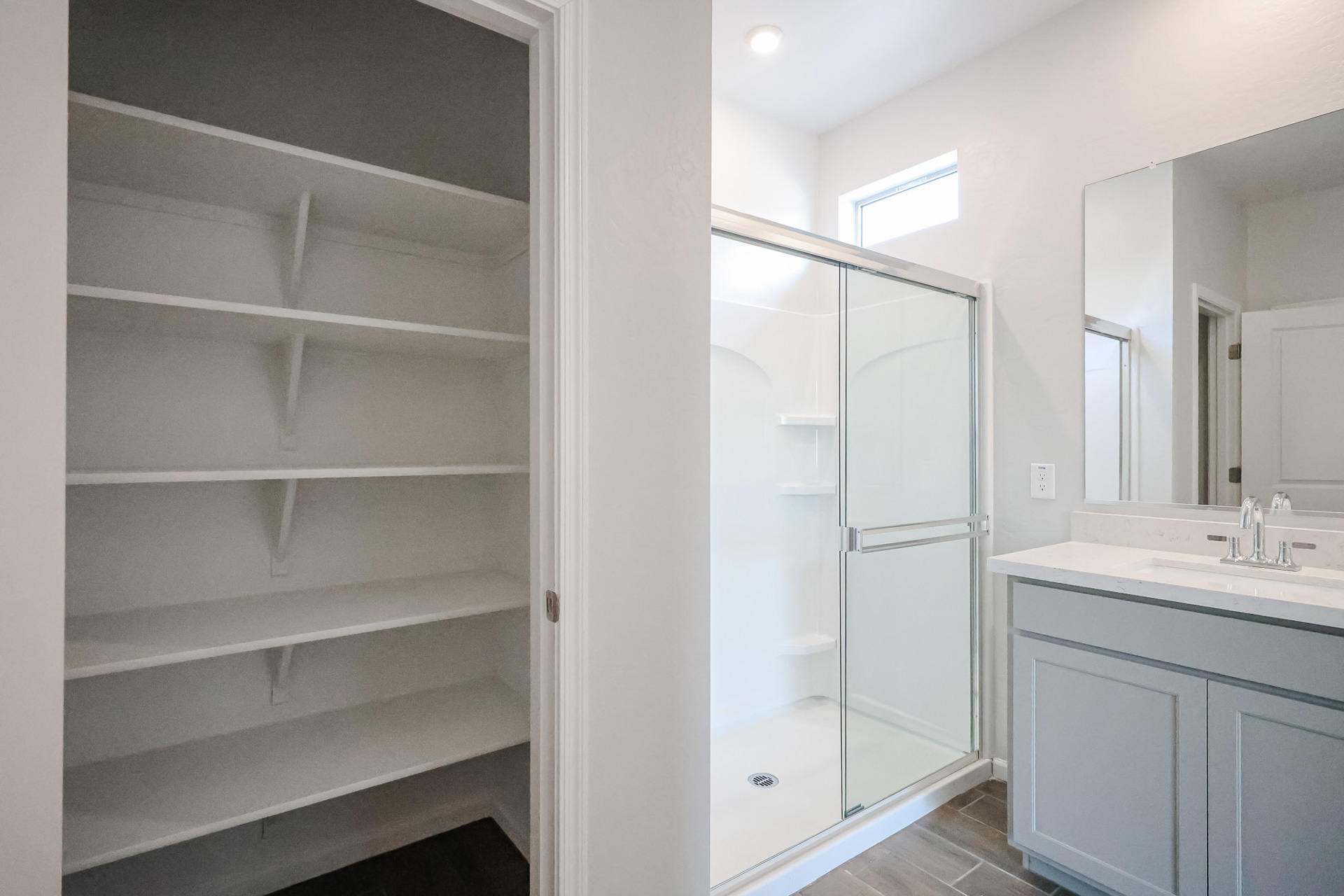 A bathroom with a glass shower.