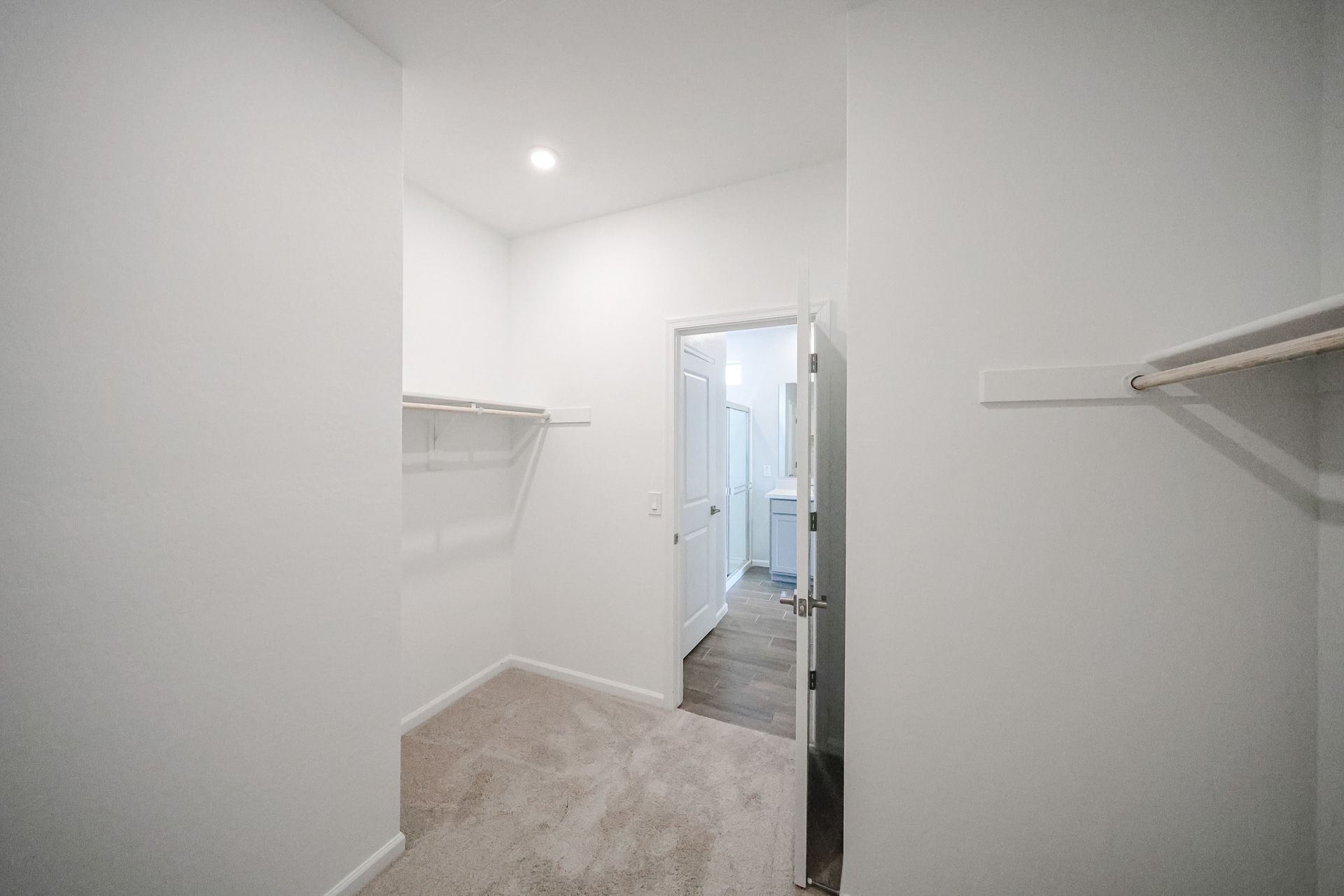 A hallway with white walls.