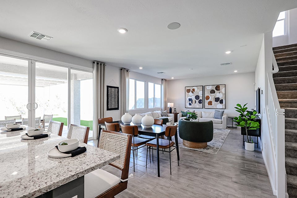 A room with a table and chairs.