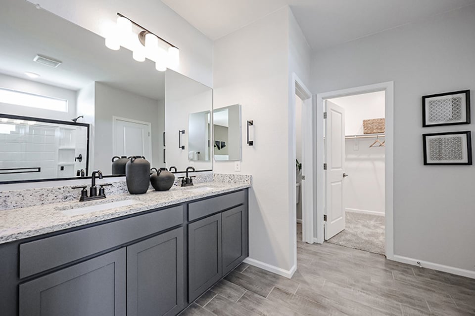 A bathroom with a marble countertop.