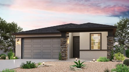 A house with a gravel driveway.