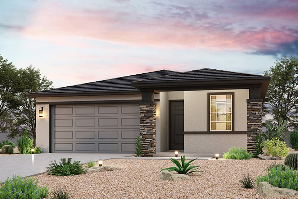 A house with a gravel driveway.