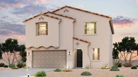 A white house with a garage.