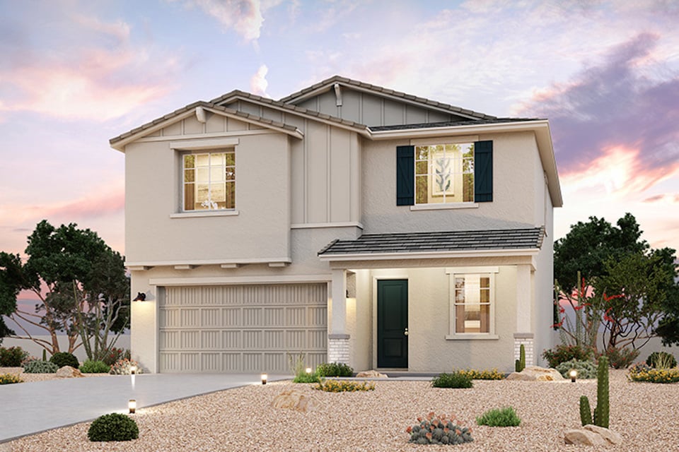 A white house with a garage.