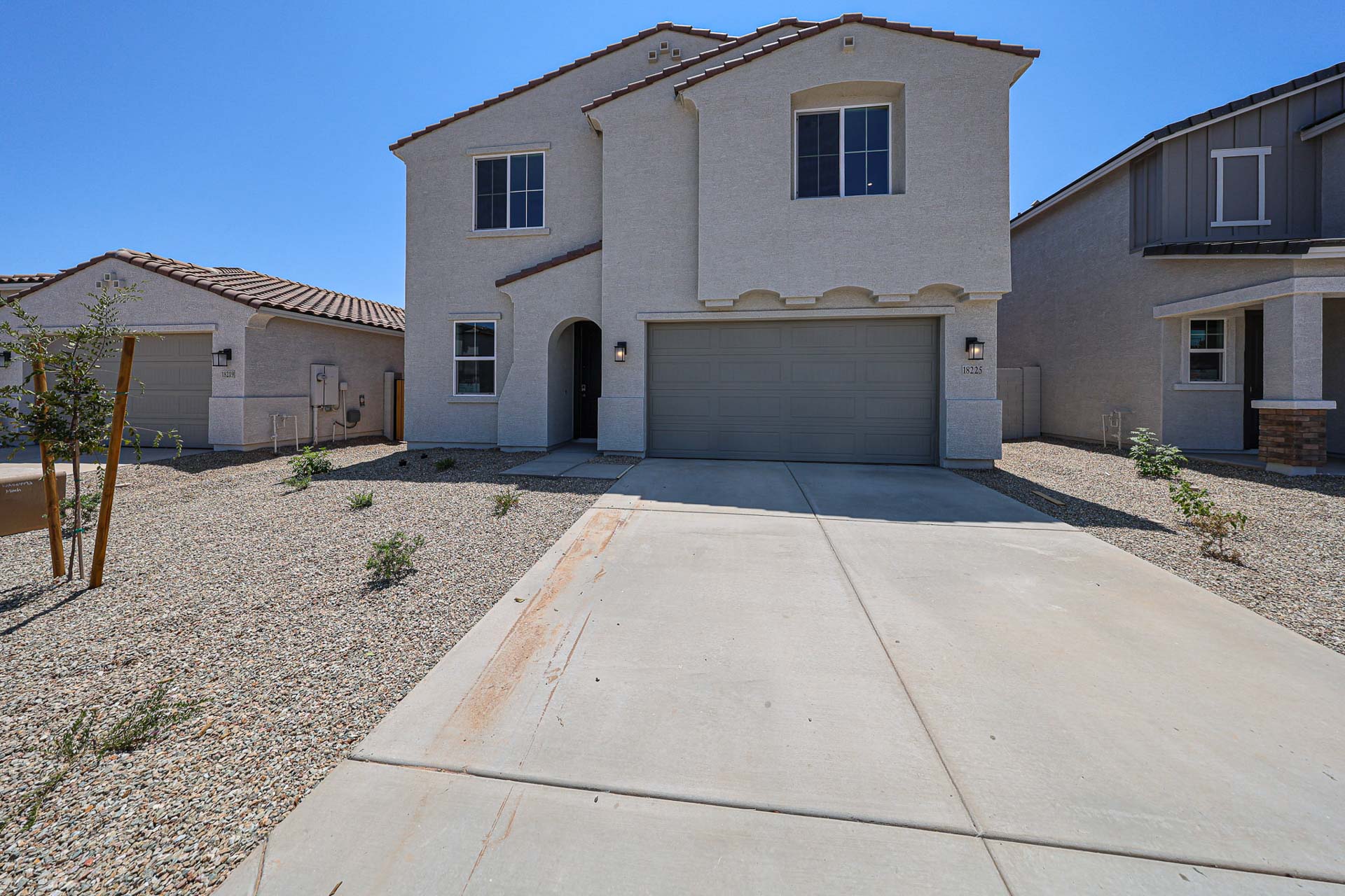A driveway leading to a house.