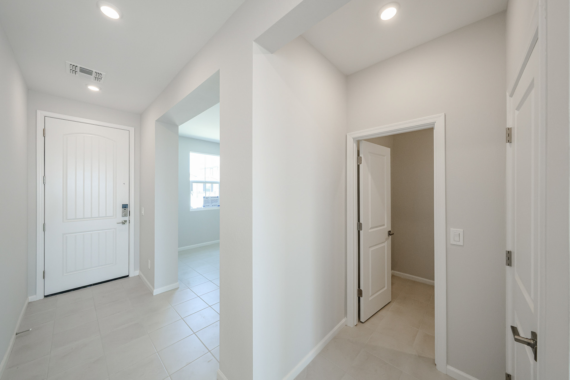 A hallway with white doors.