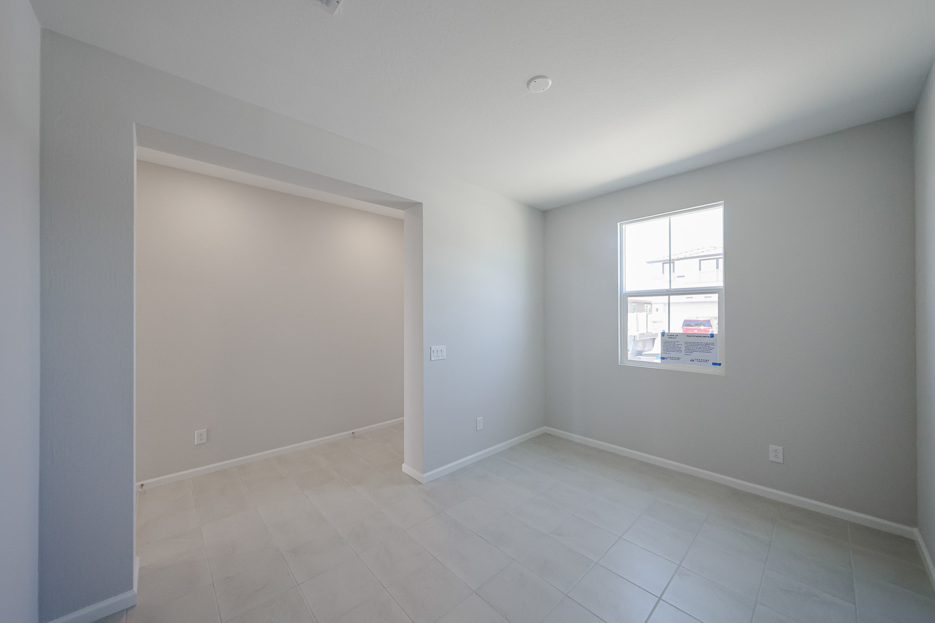 A room with a door and a window.