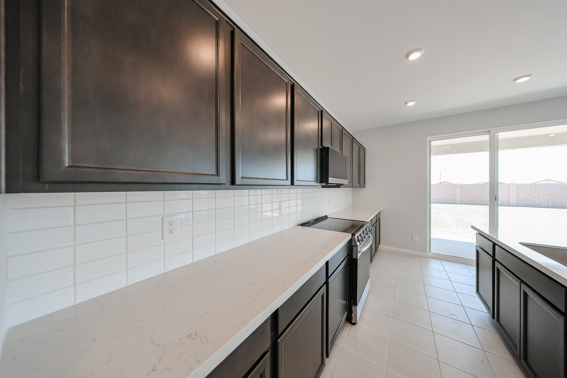 A kitchen with white tile.