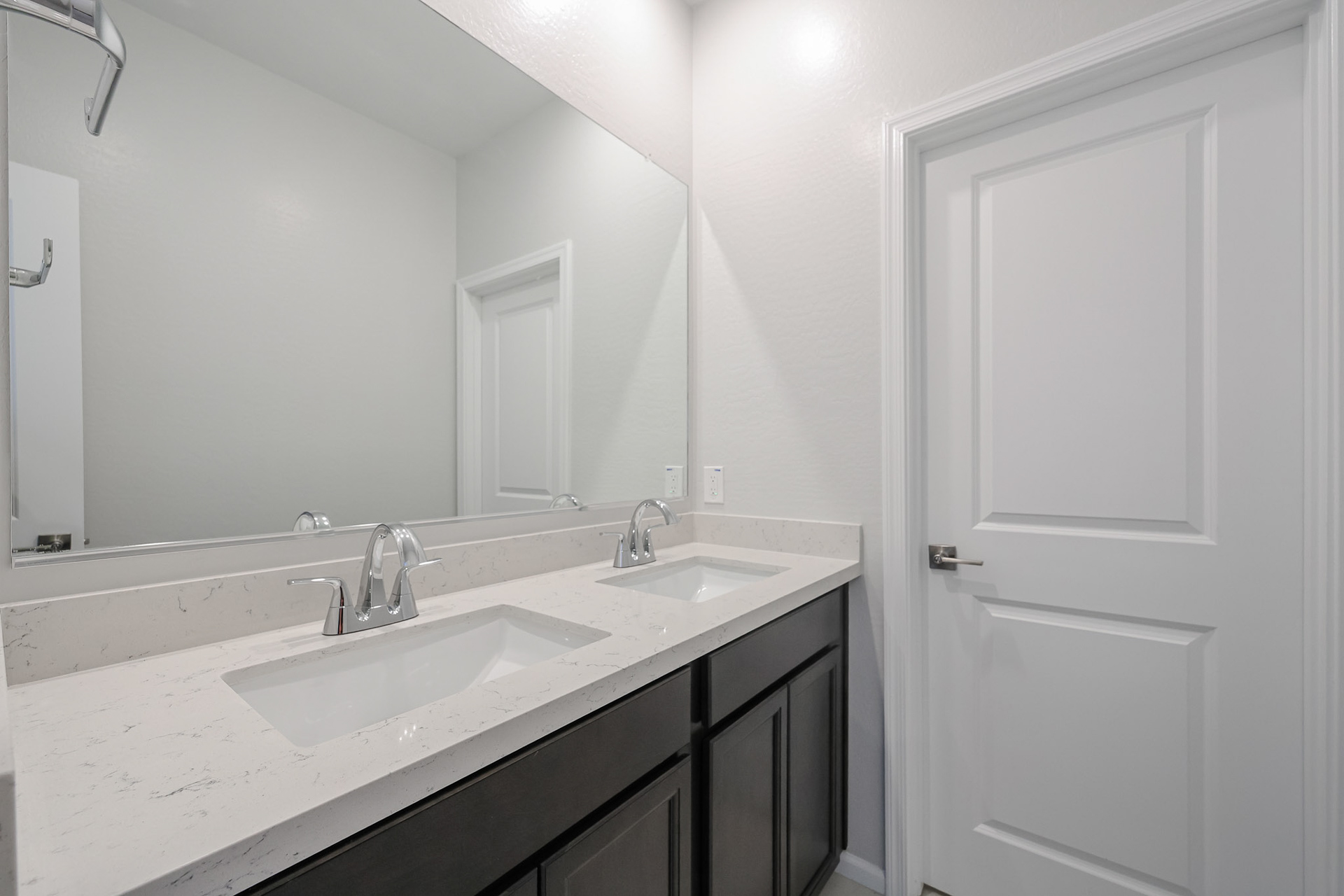 A bathroom with two sinks.