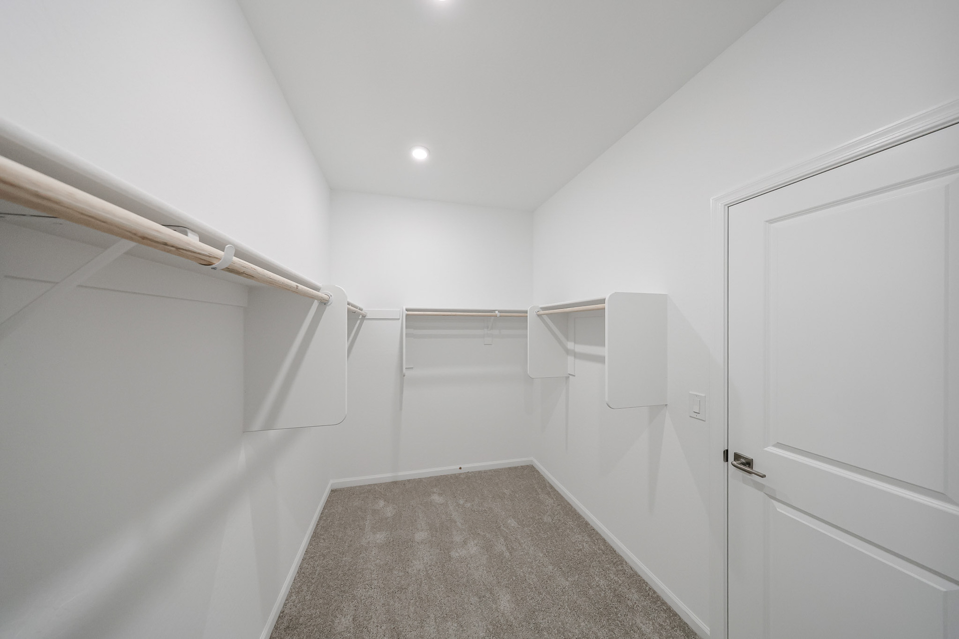 A hallway with white walls.