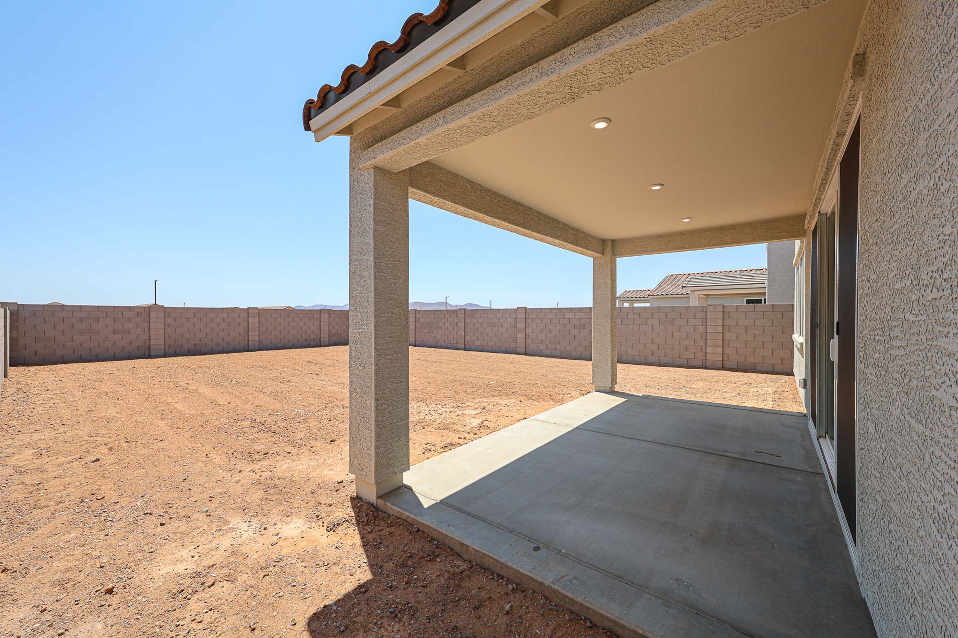 A concrete structure with a roof.
