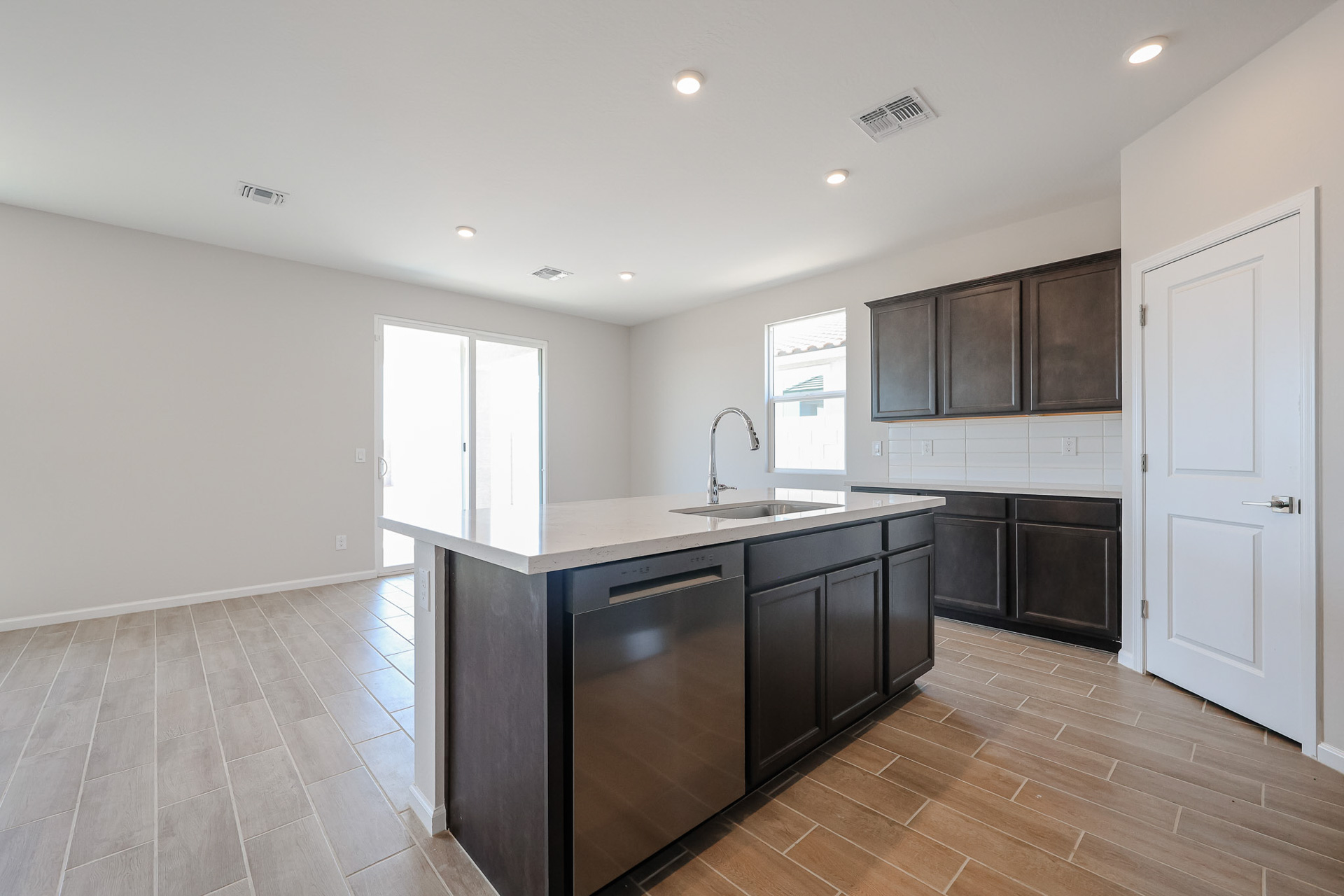 A kitchen with black appliances.
