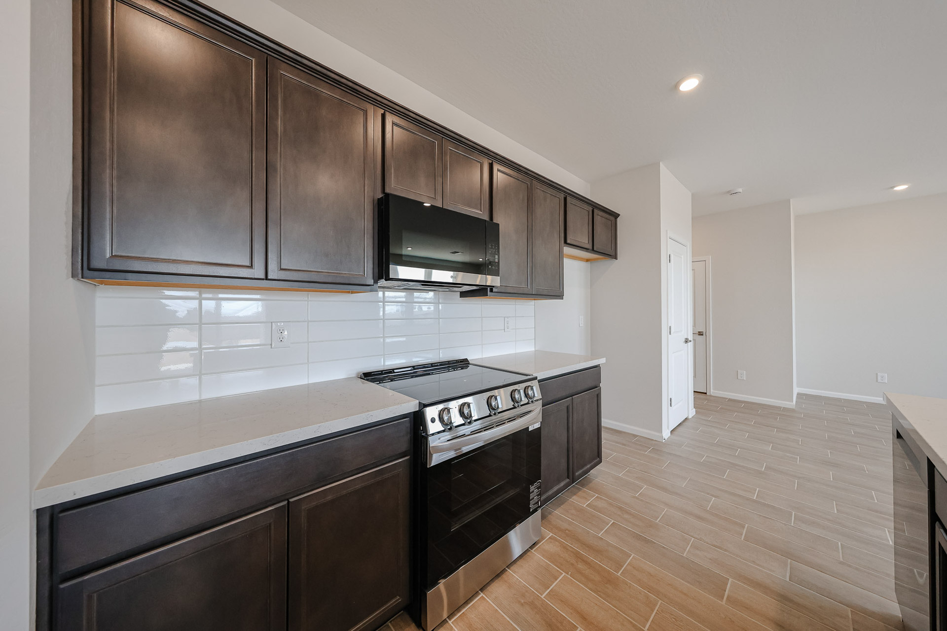 A kitchen with wooden cabinets.