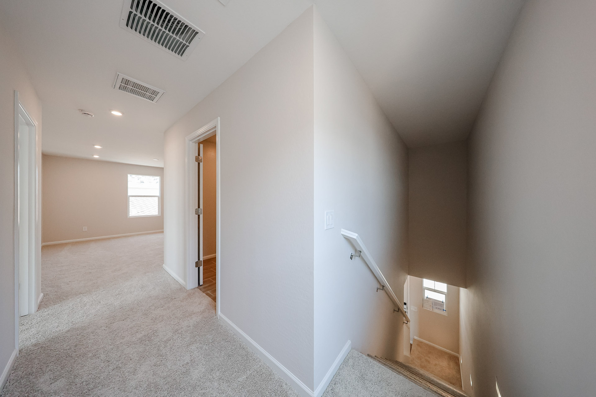 A hallway with white walls.