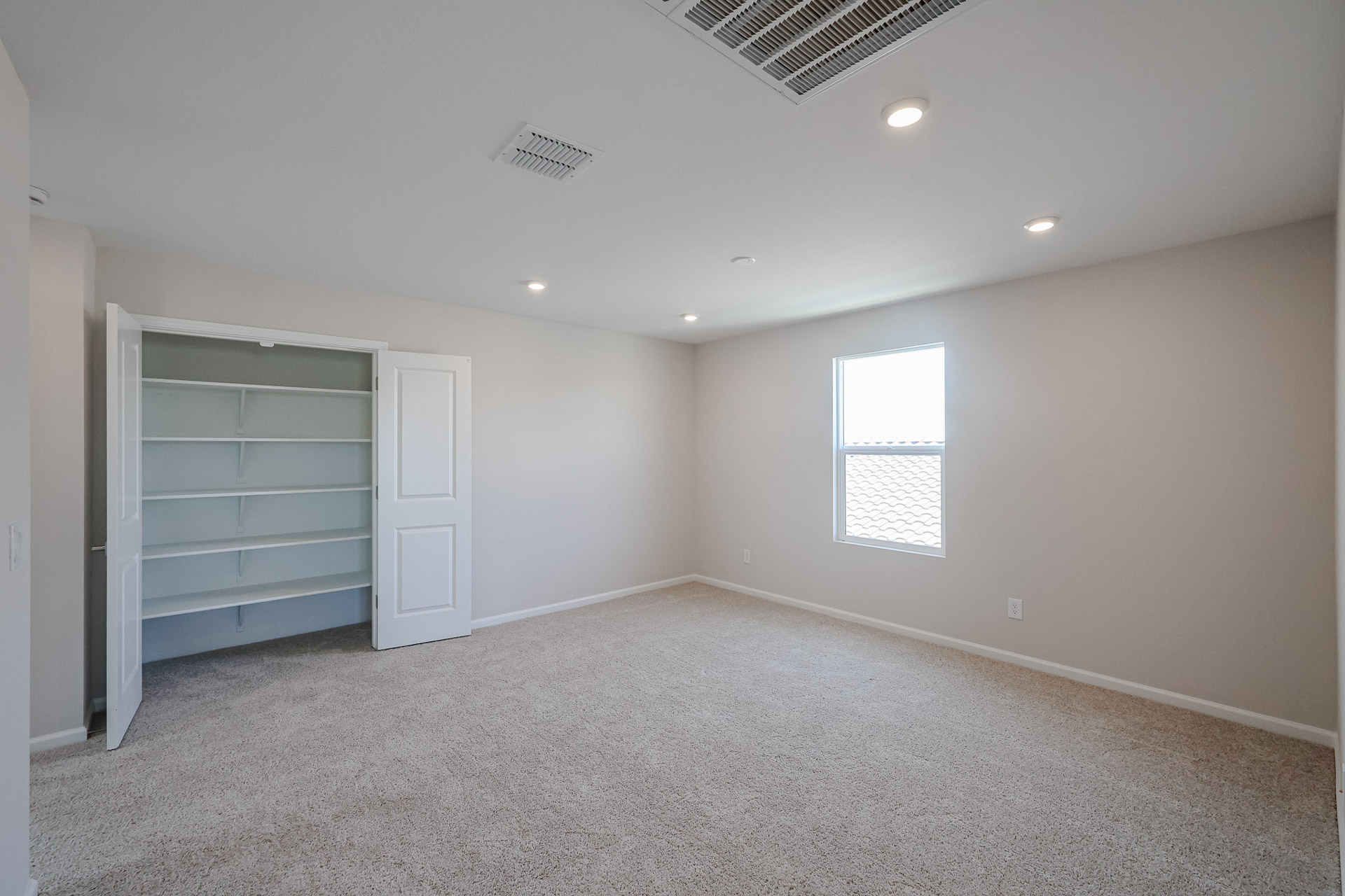 A room with white walls and a white door.