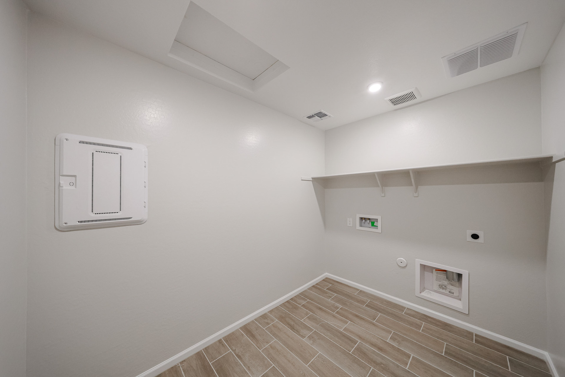 A hallway with white walls.