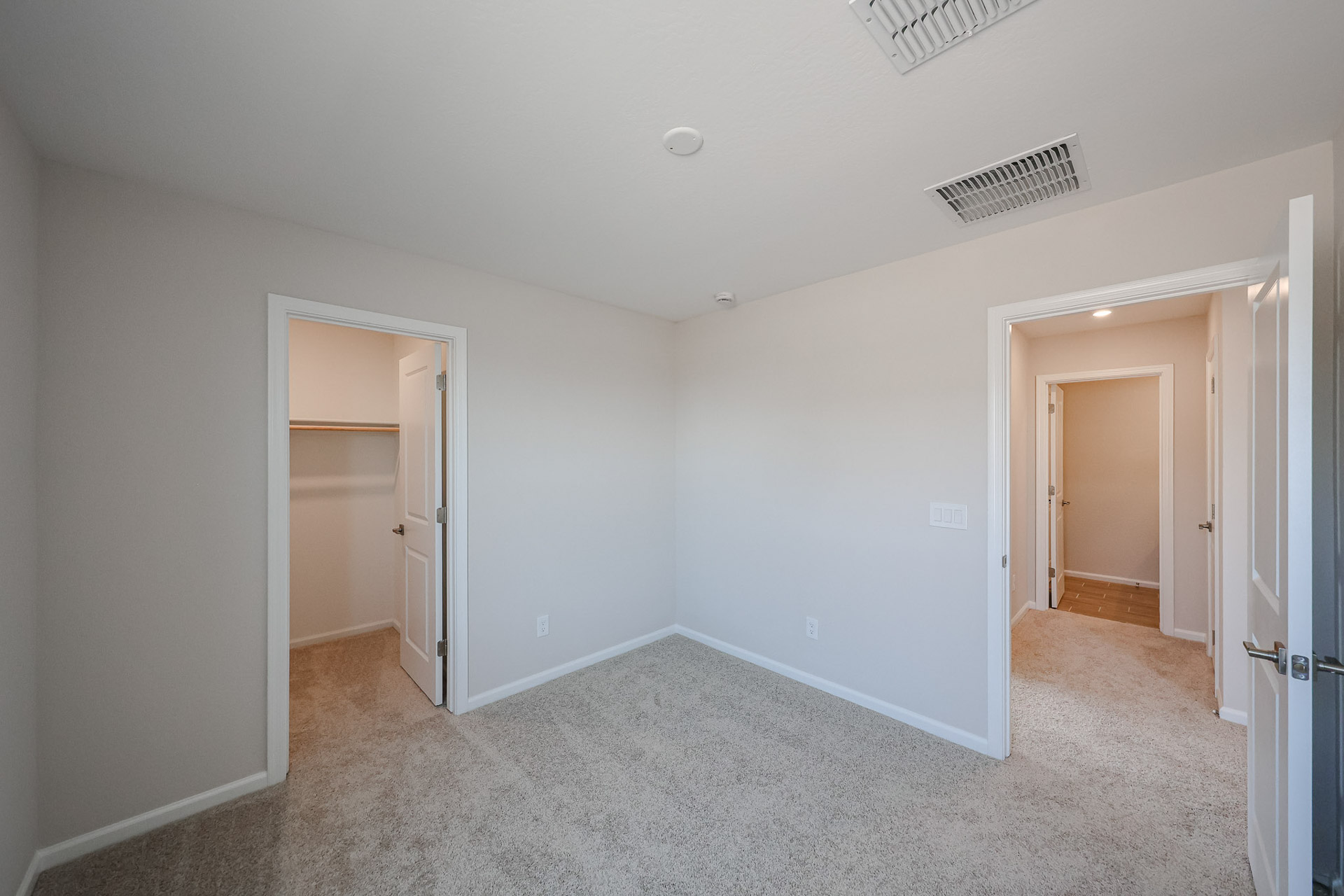 A hallway with white walls.