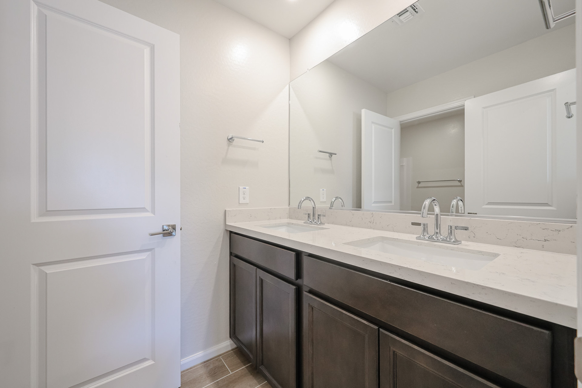 A bathroom with a marble countertop.