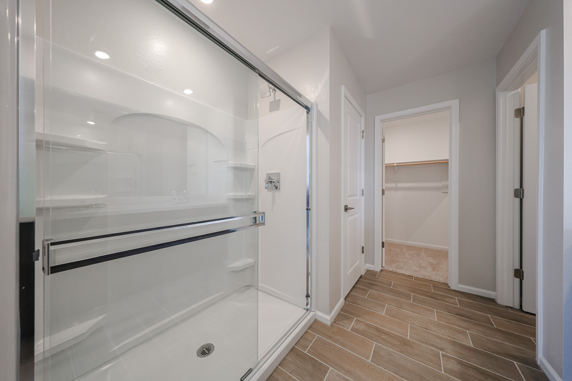 A bathroom with a glass shower.