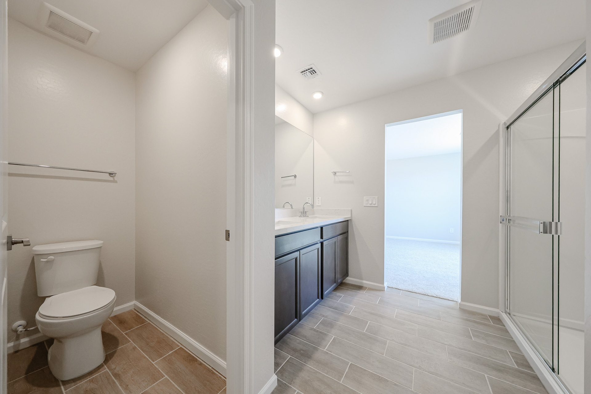 A bathroom with a glass shower.