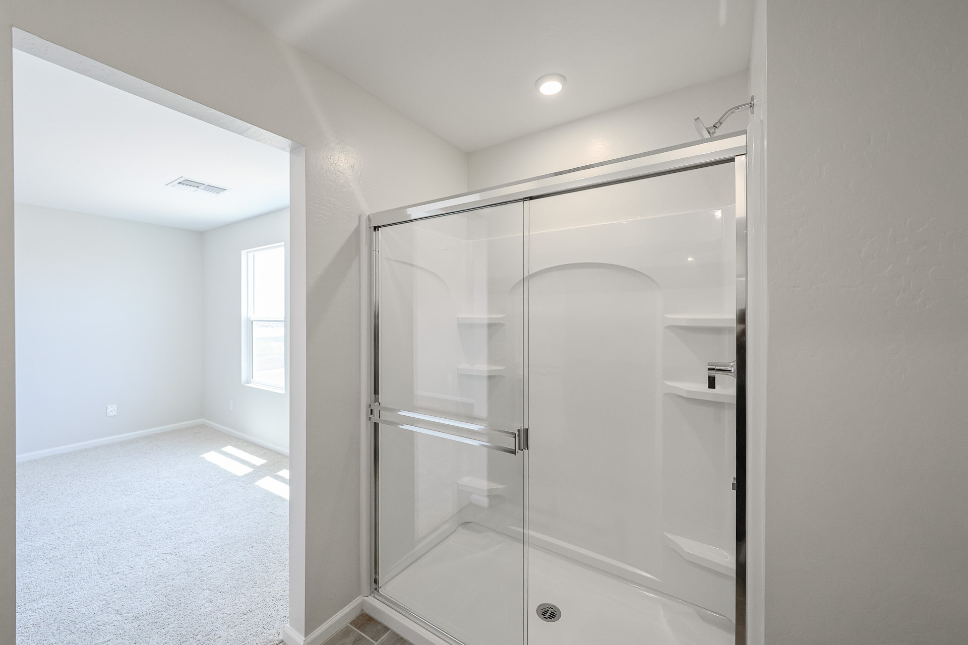 A shower unit in a bathroom.