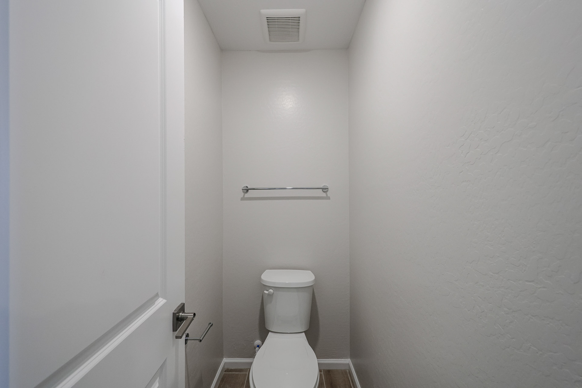A toilet in a bathroom.