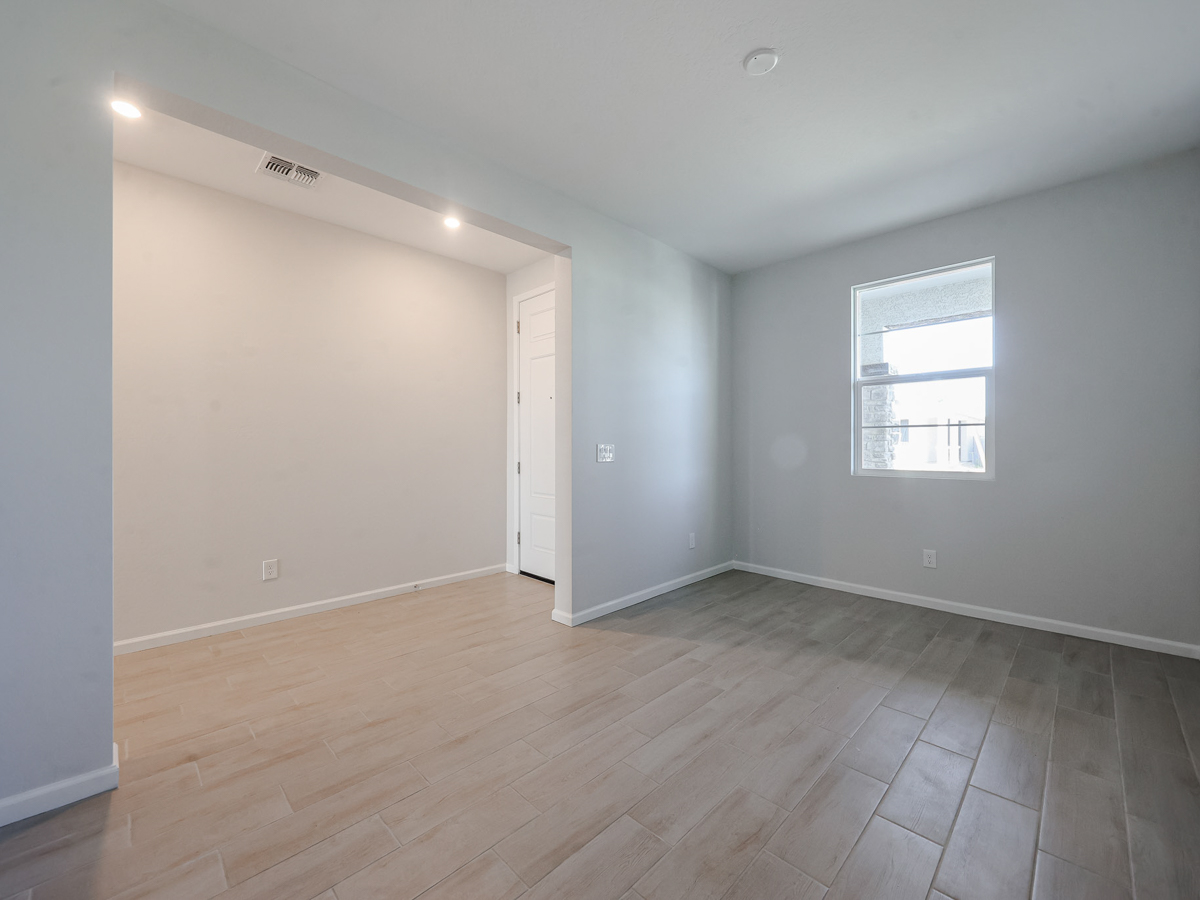 A room with a wood floor and a wood floor.