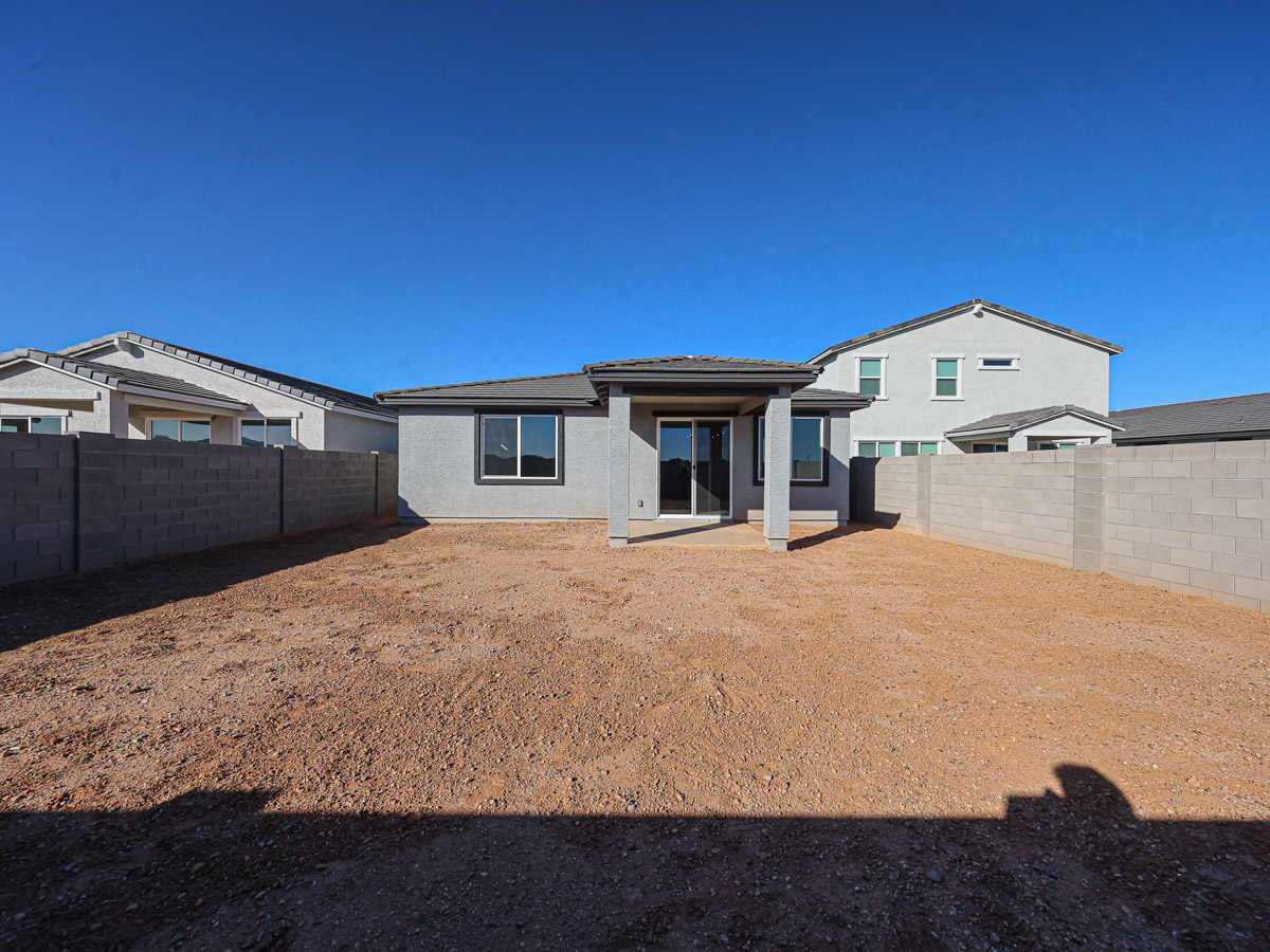A house with a dirt yard.