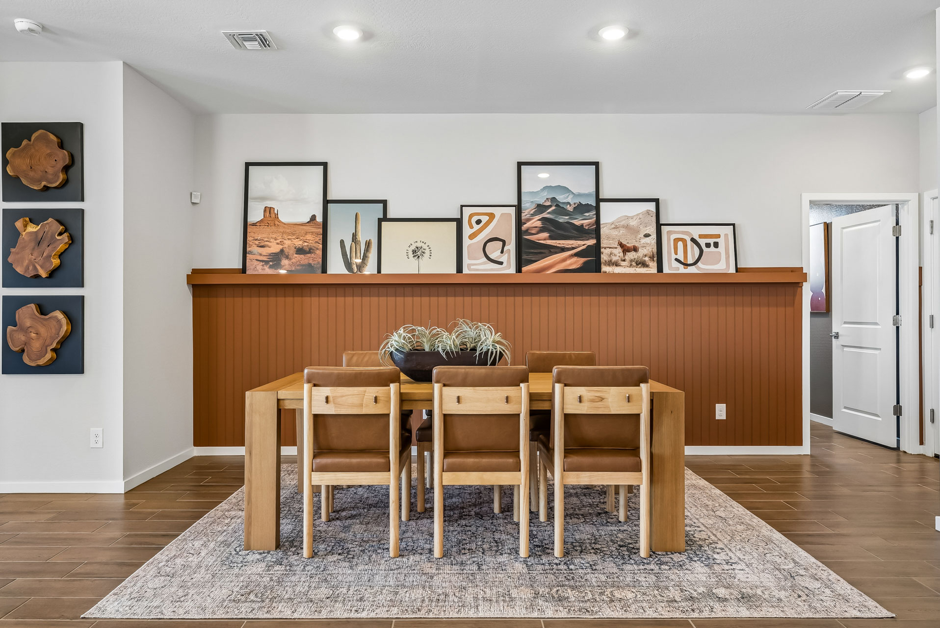 A room with a table and chairs.