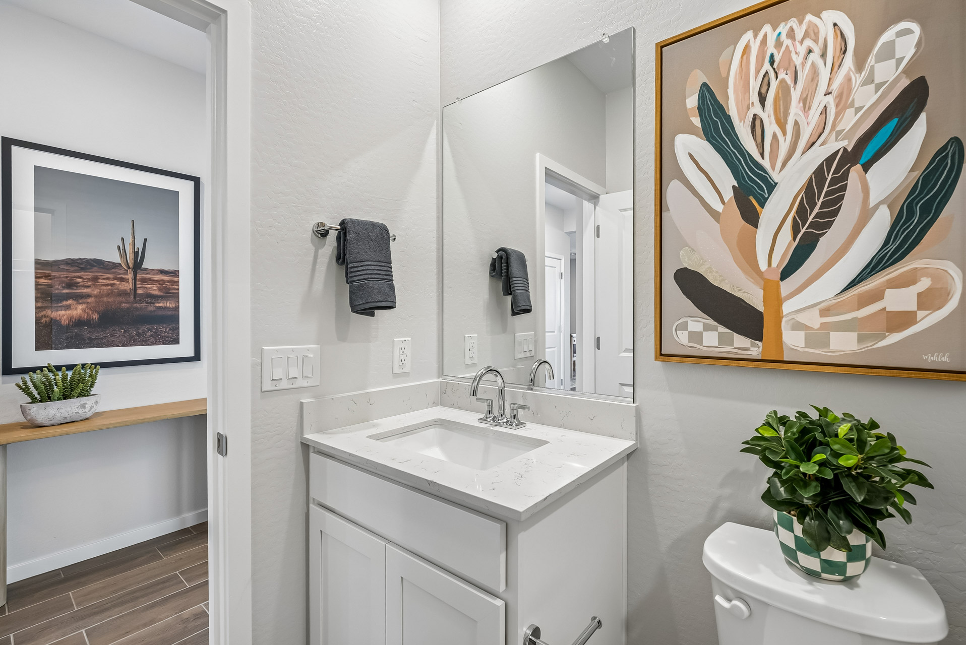 A bathroom with a sink and a mirror.