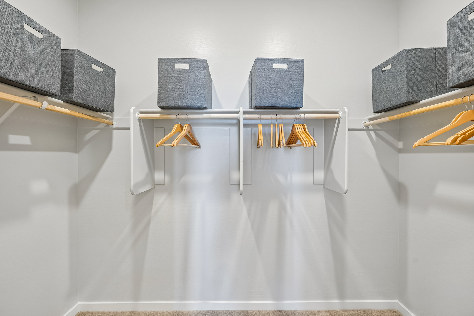A group of luggage sits on a shelf.