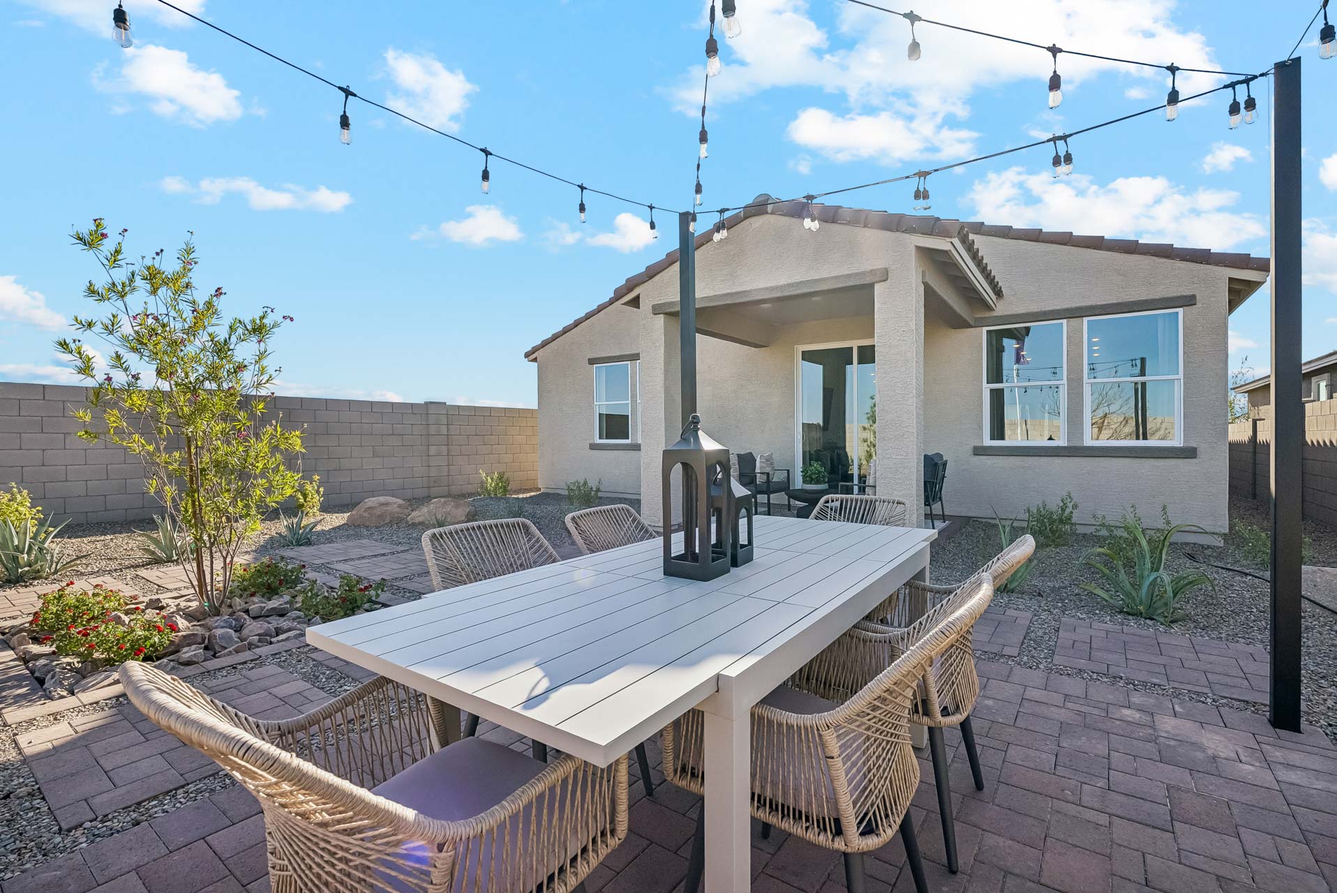 A patio with a table and chairs.