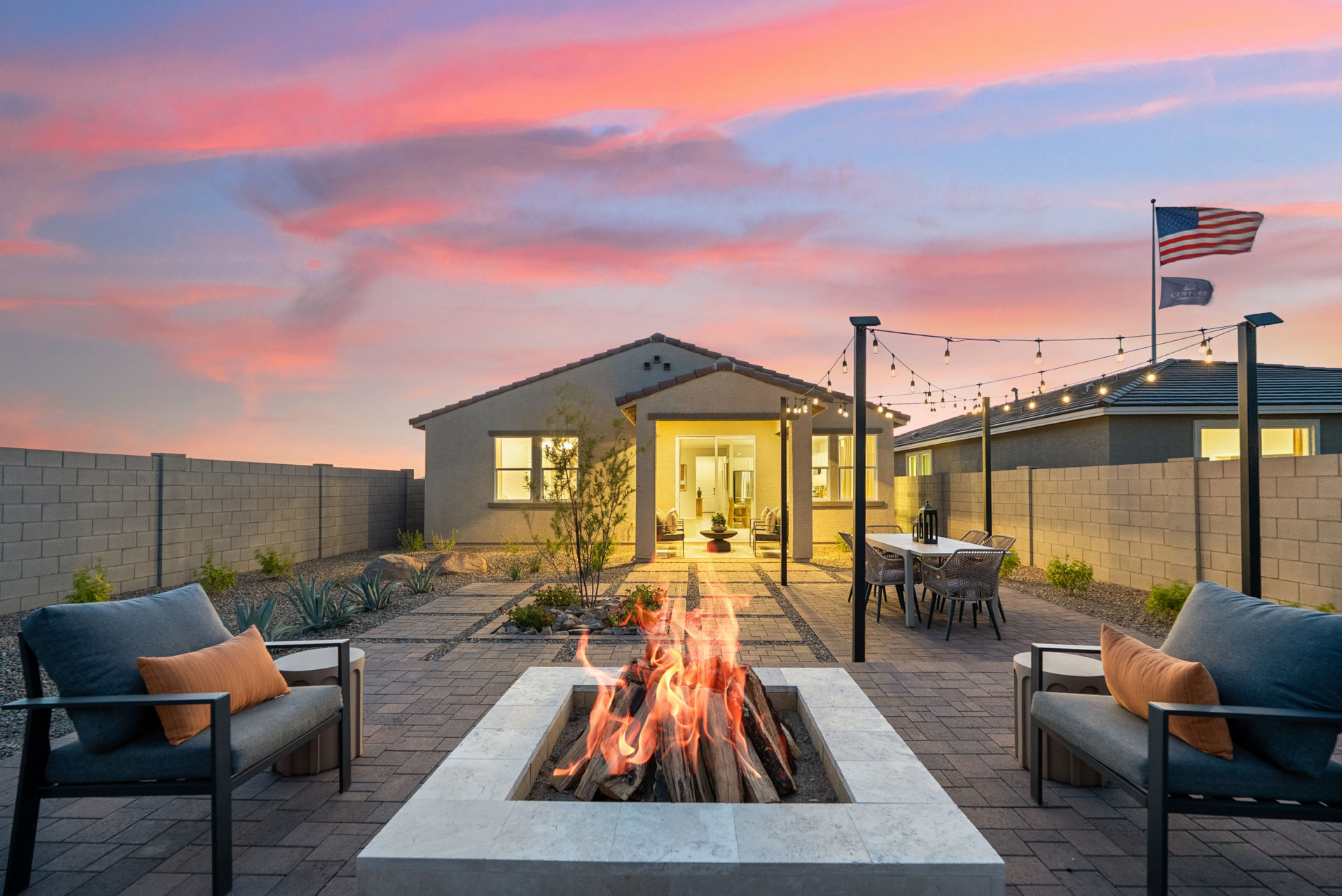 A fire pit outside a house.