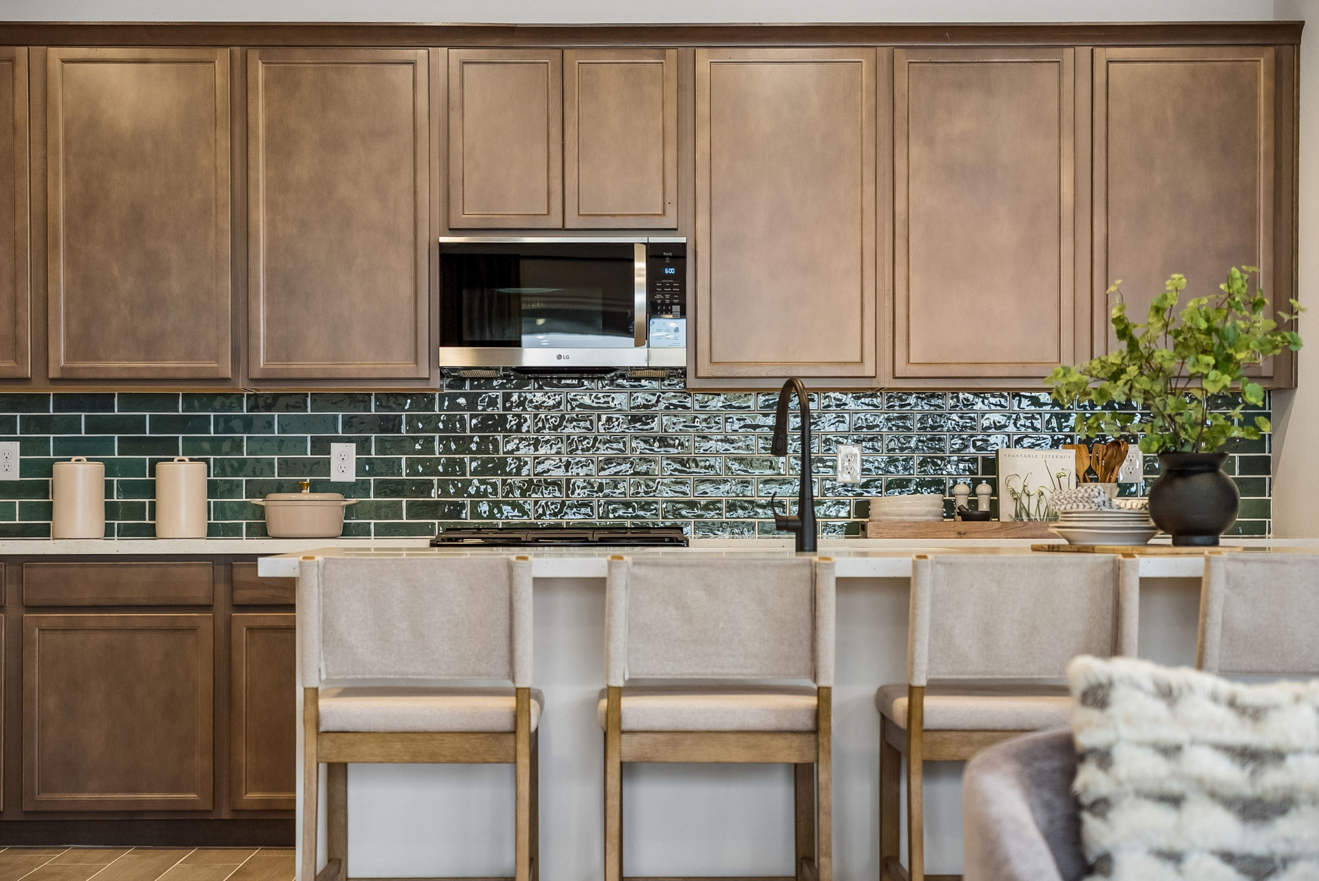 A kitchen with wooden cabinets.
