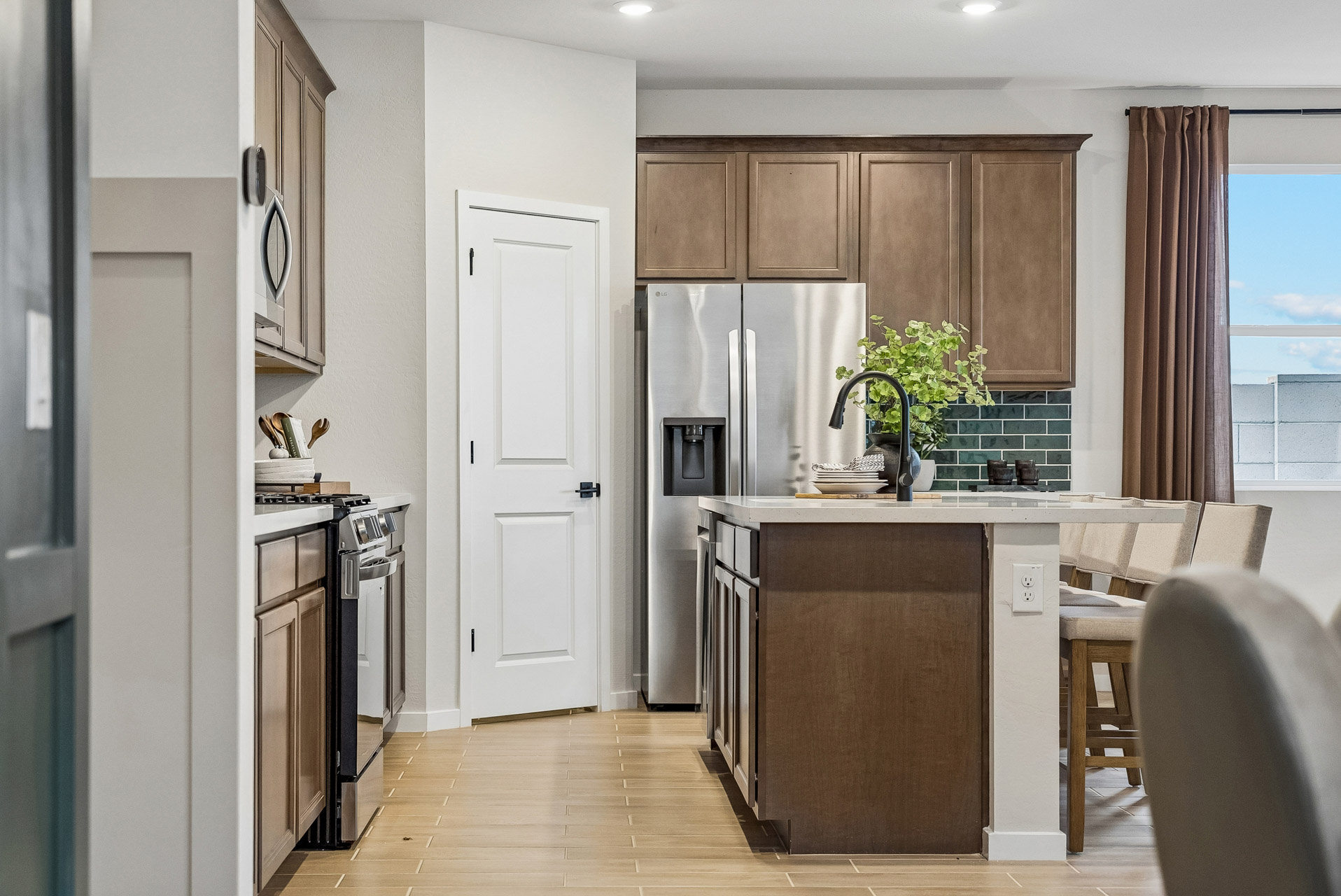 A kitchen with wooden cabinets.