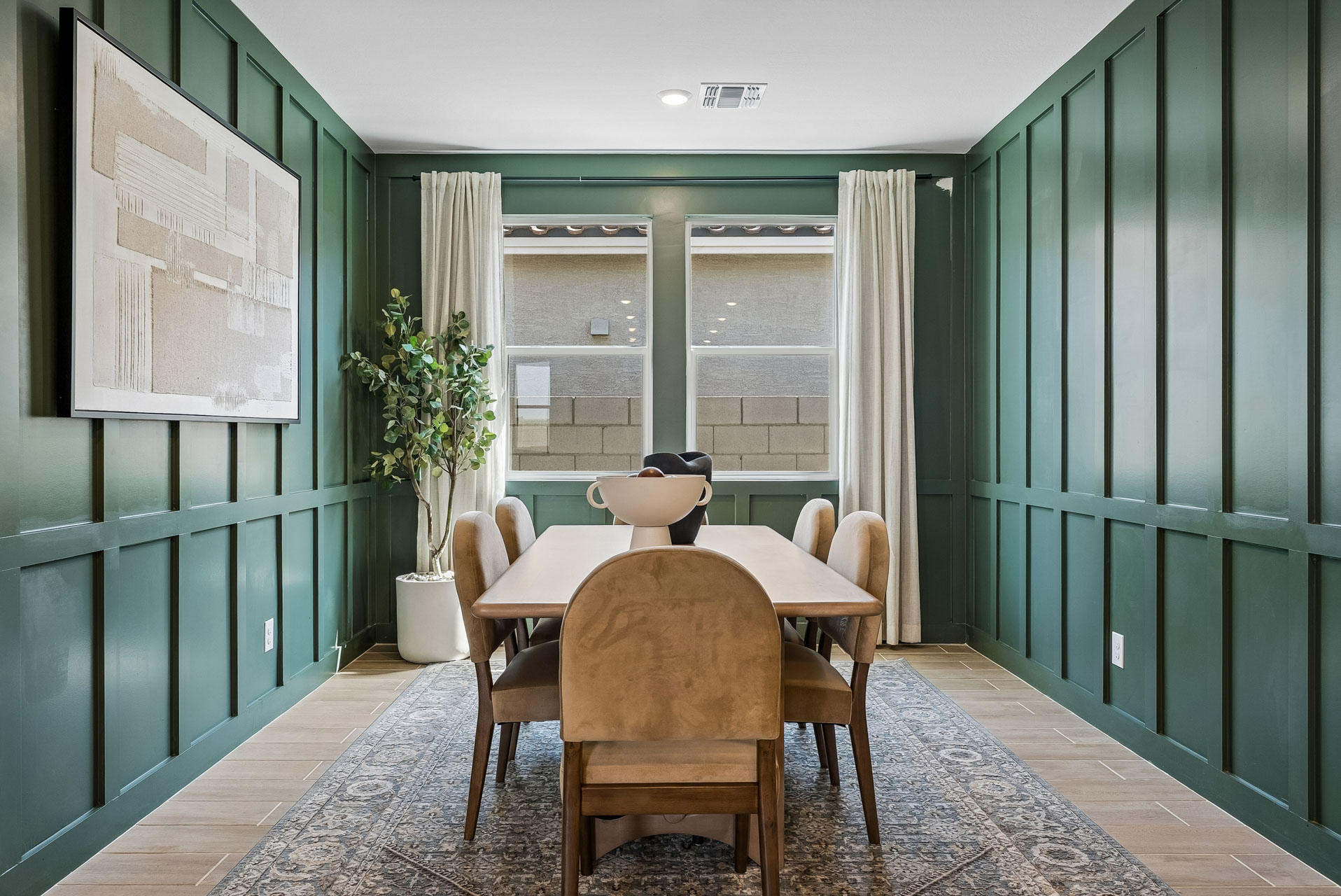 A room with a table and chairs.