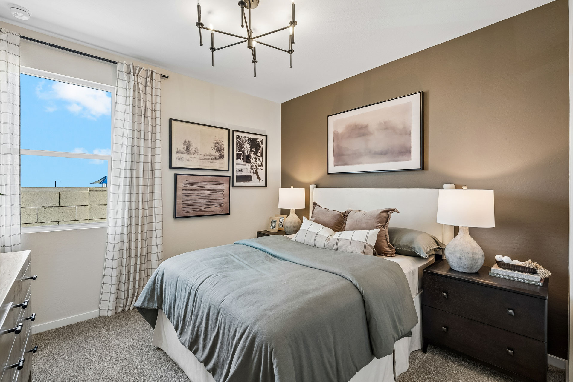 A bedroom with a bed and a window.