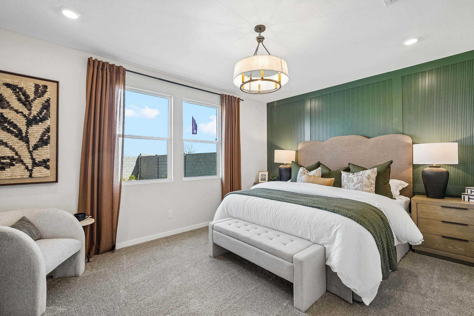 A bedroom with a large bed and a large window.