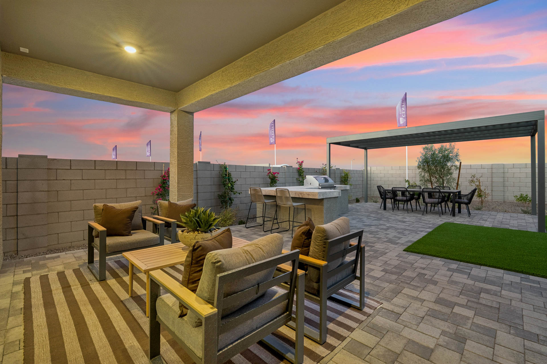 A patio with a table and chairs.