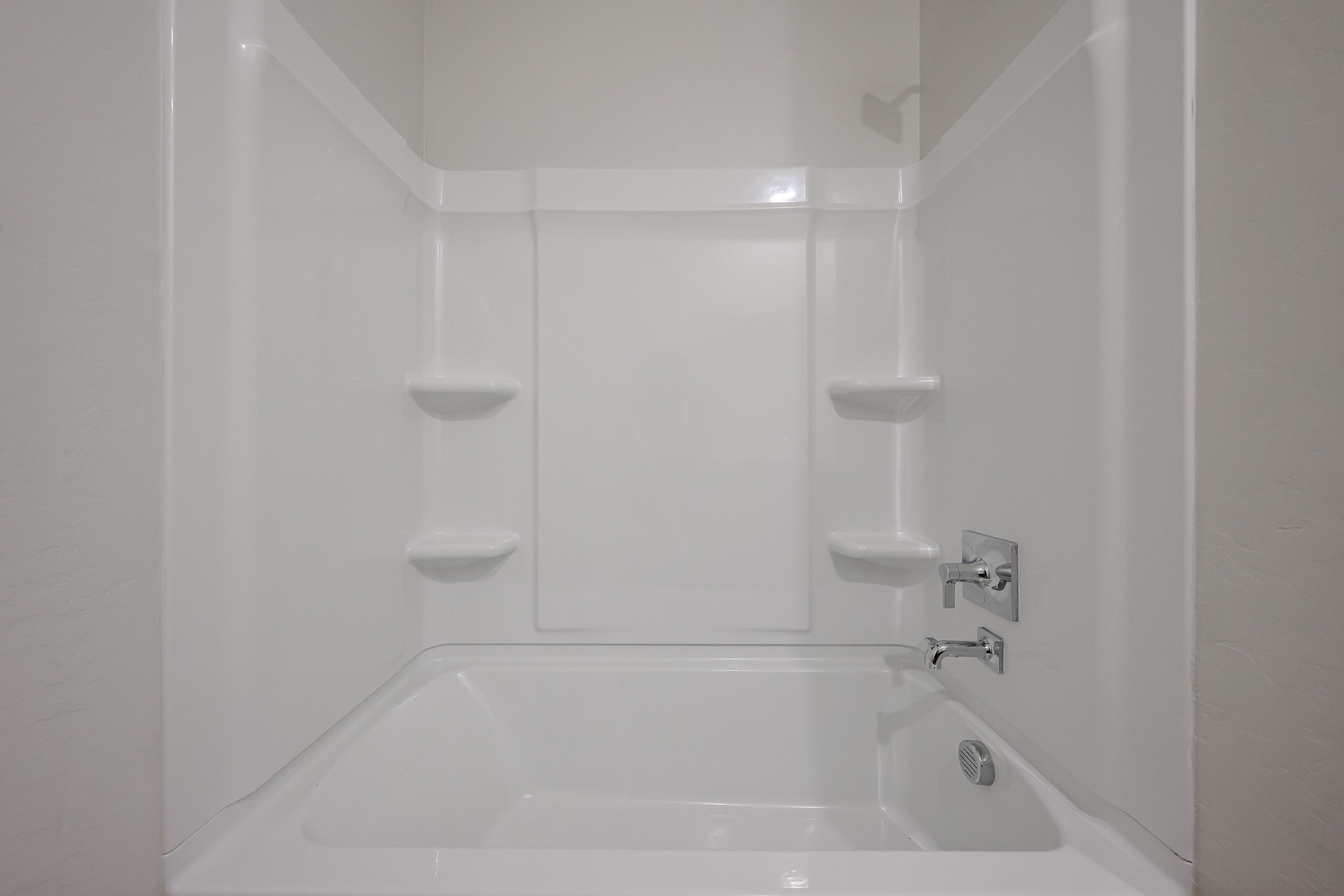 A bathtub and sink in a bathroom.