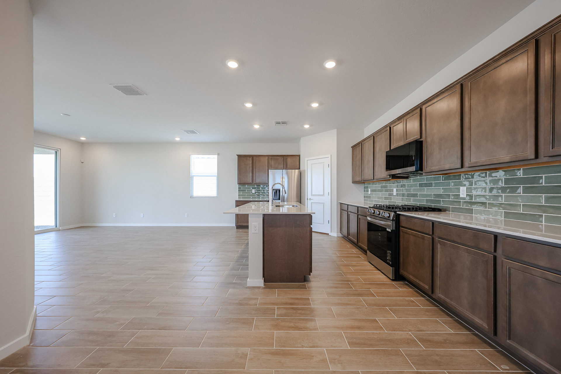 A large kitchen with wooden cabinets.