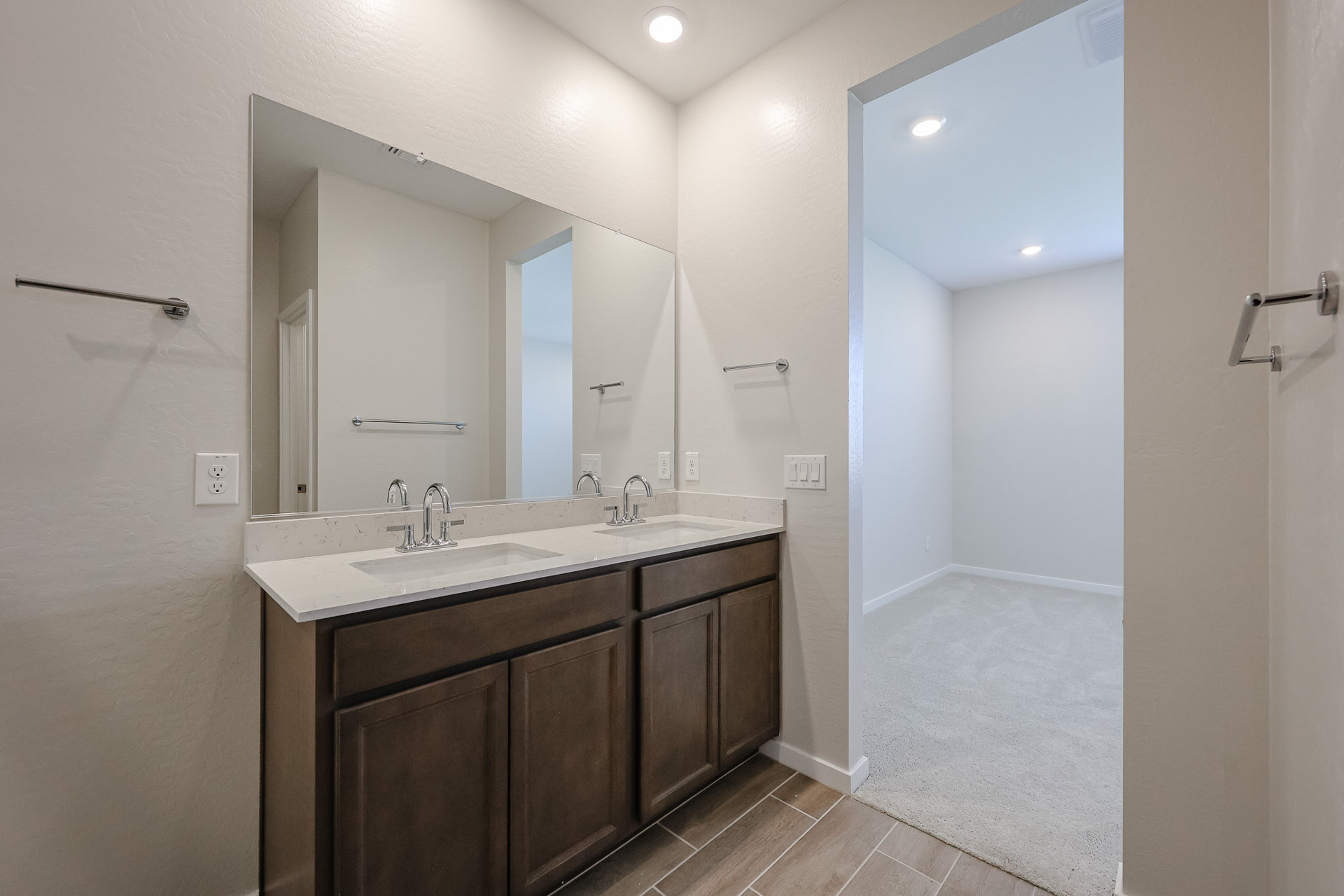A bathroom with a large mirror.