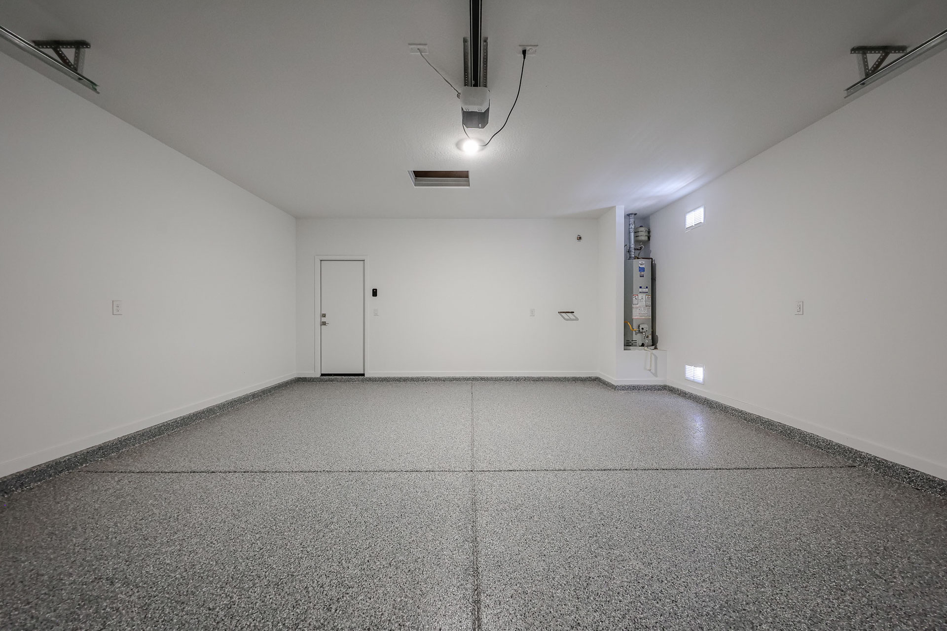 A room with a white wall and a white door.
