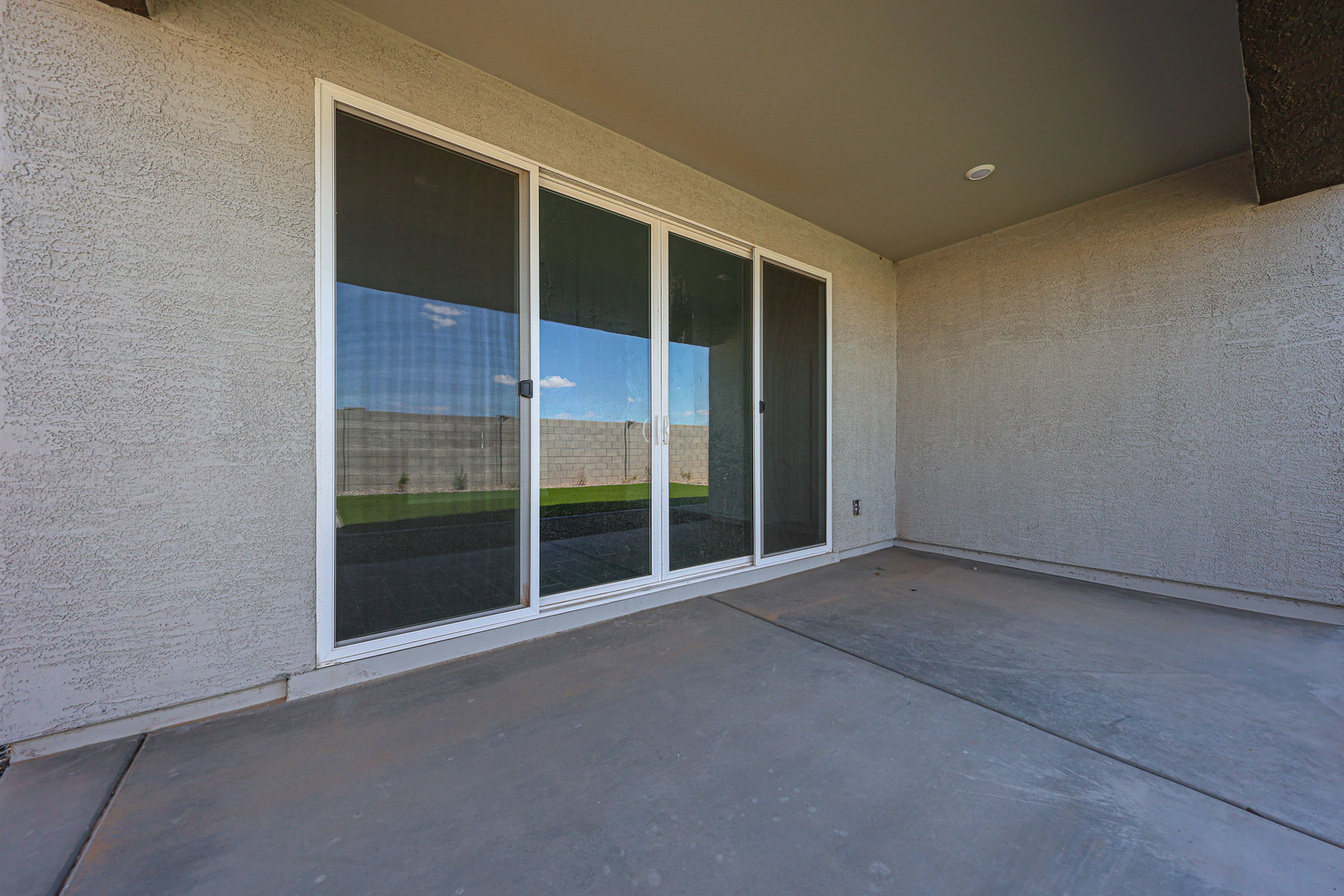 A room with a window and a door.