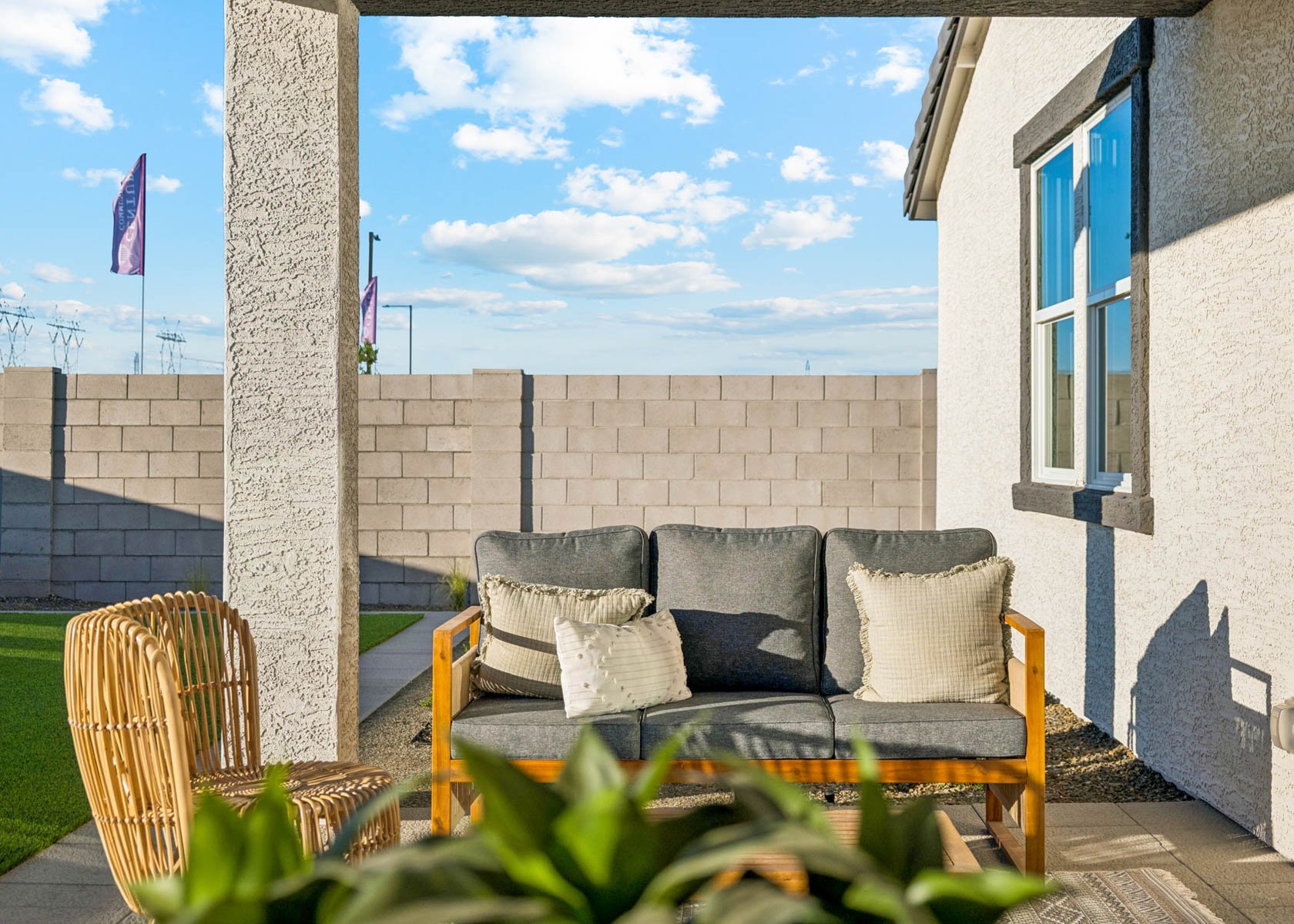 A couch and chairs outside.