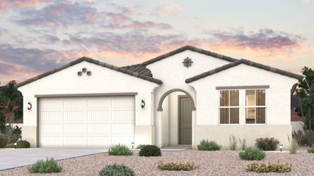 A house with a garage and a gravel driveway.