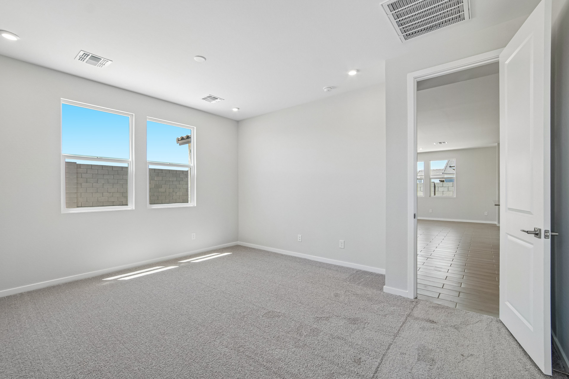 A room with a door and a window.