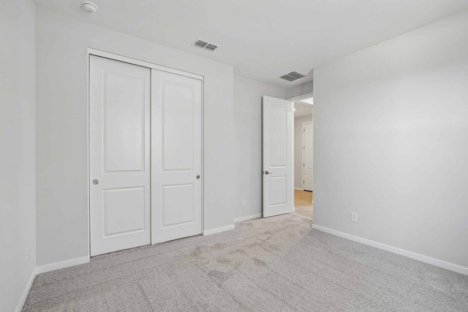 A room with white doors.